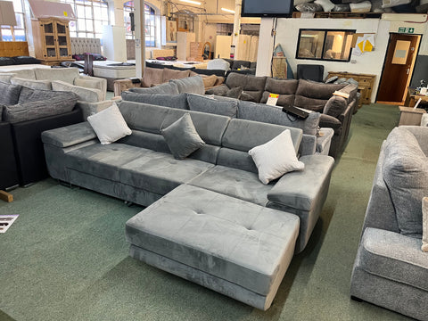 Plush grey corner sofa bed